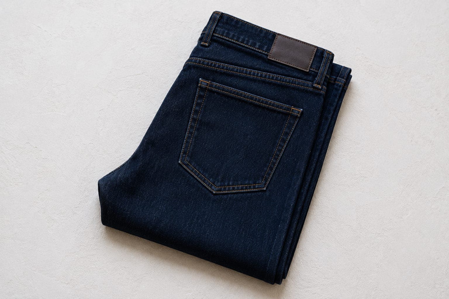Dark wash denim is the unsung hero of the wardrobe. It reads casual enough for weekends but polished enough for dinner out or a relaxed office environment.